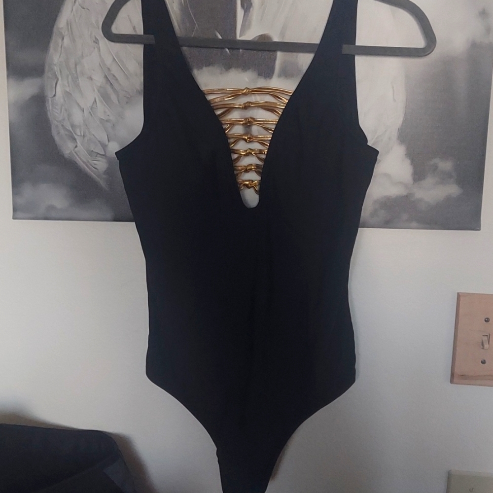 K, Jordon: Size Medium, pretty black with gold metallic on top.  $59 Swimsuit
